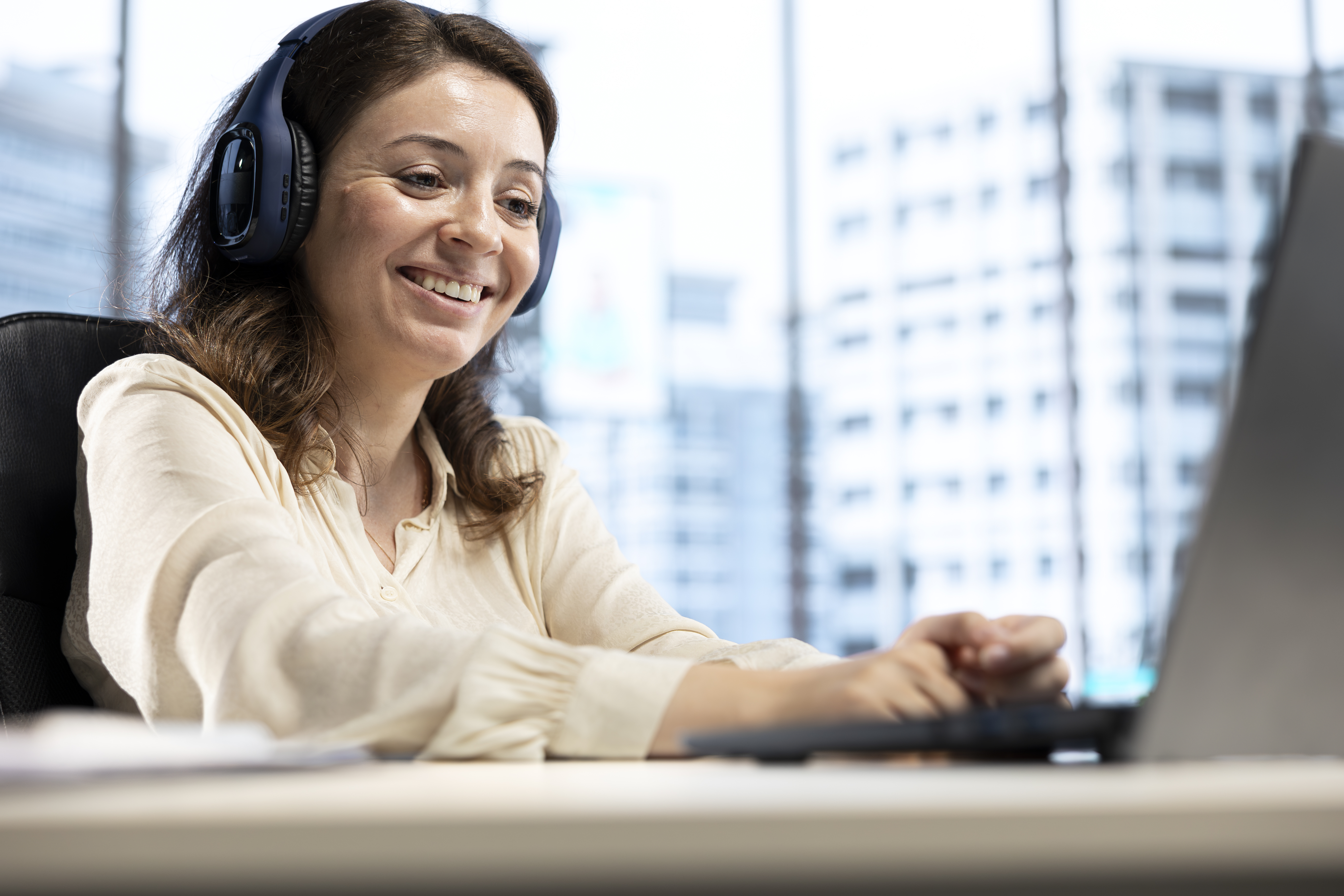 confident-pleased-entrepreneur-having-fun-with-her-favorite-audiobook